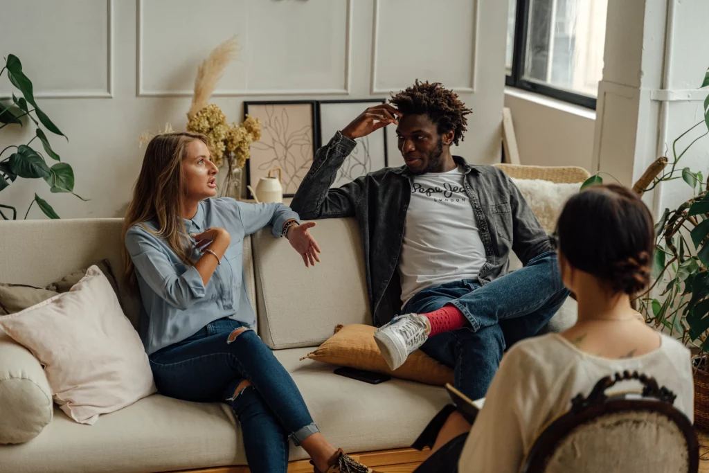 Can couples therapy help a toxic relationship? This couple demonstrates that it can, with their happy faces chatting away on a couples therapy couch.